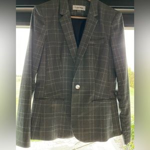 Never worn (with tag) Calvin Klein suit jacket. Size 8.